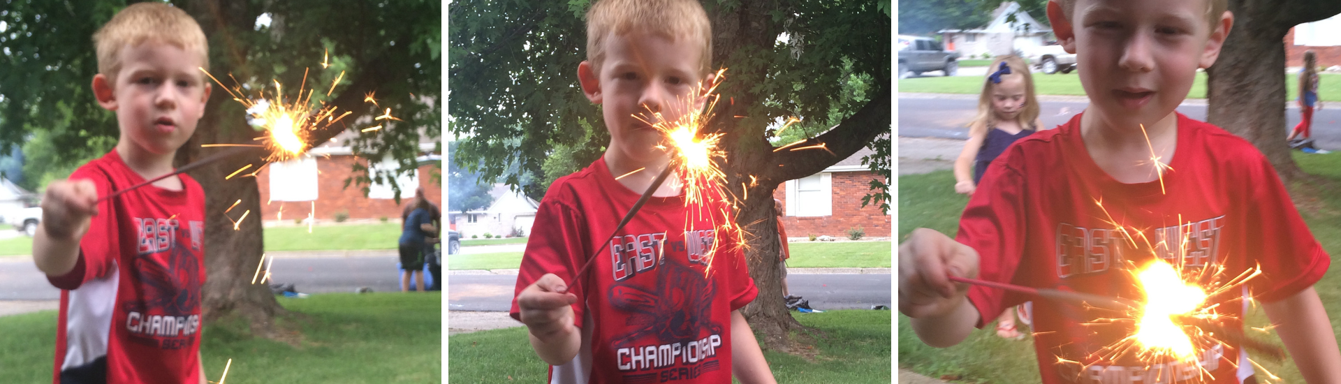 young boy holding sparkler